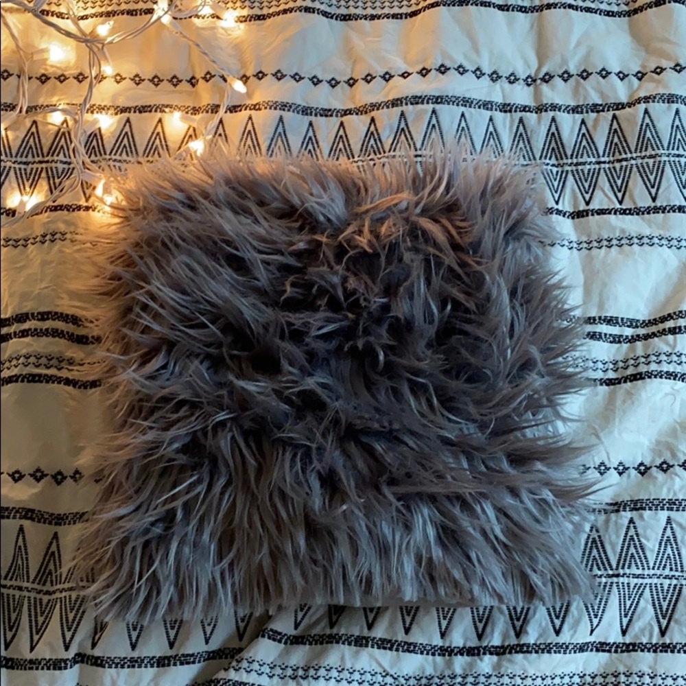 Fluffy grey throw pillow